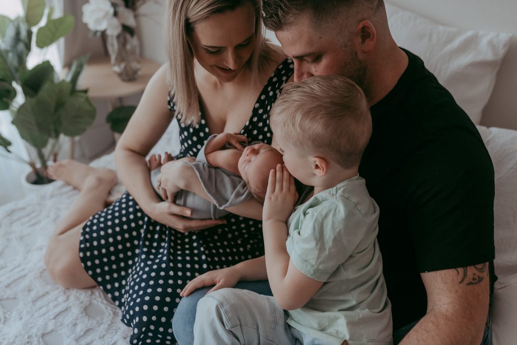 how to pose a family with newborn baby