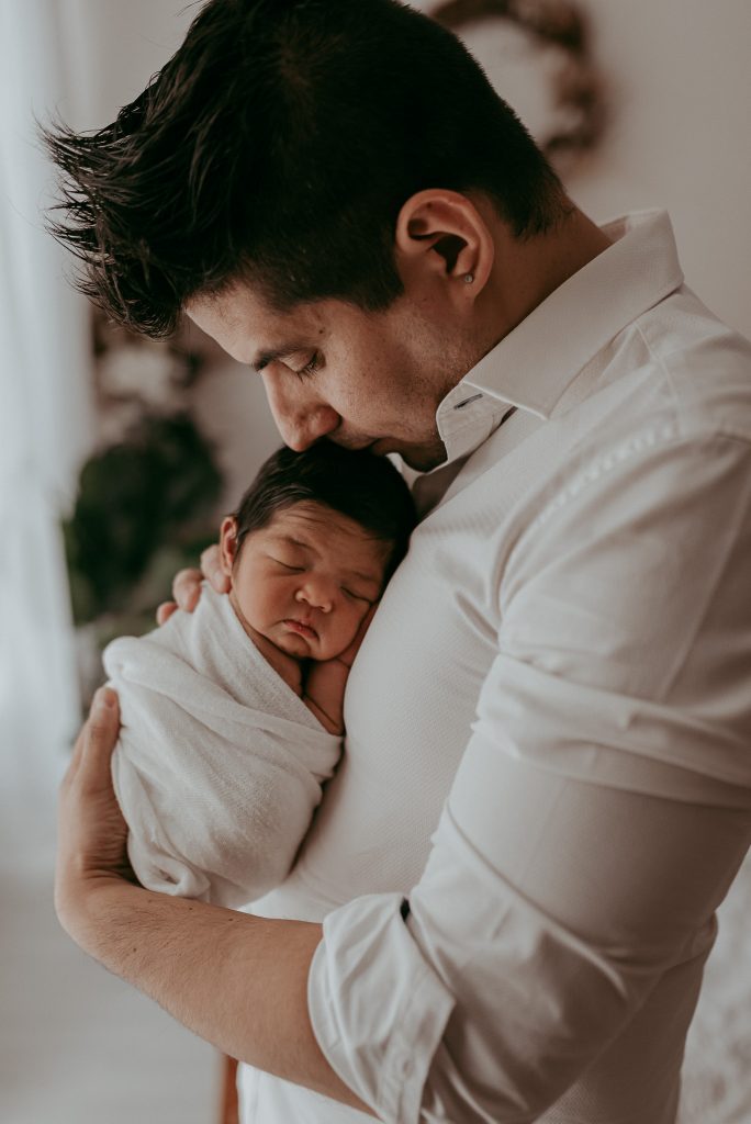 happy dad photographed in melbourne studio