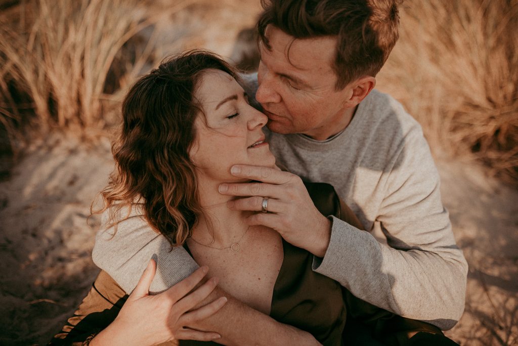 session on beach with family parents