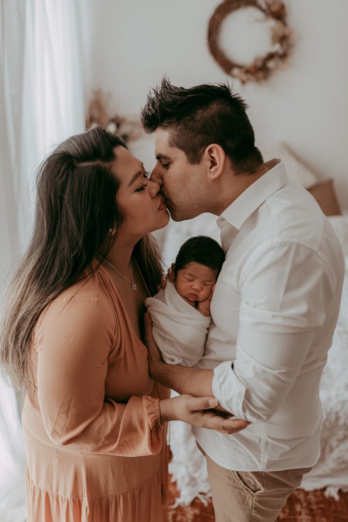 newborn baby girl with her new parents