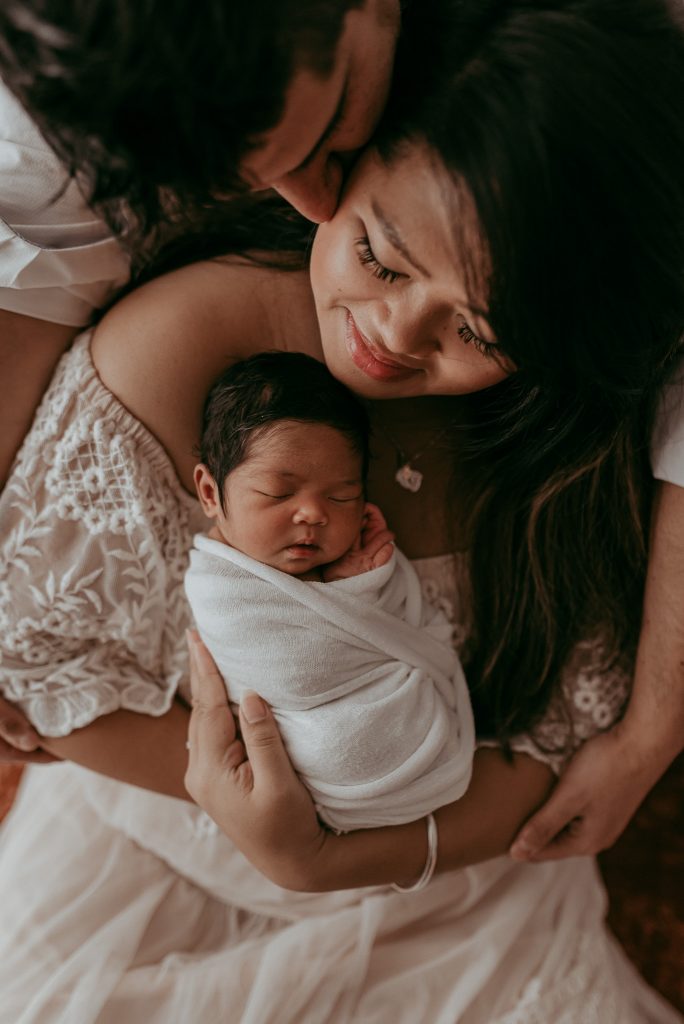 proud parents with their new family