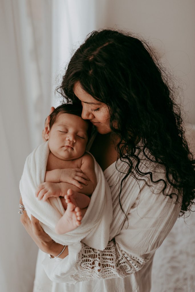 newborn family photographer with new family