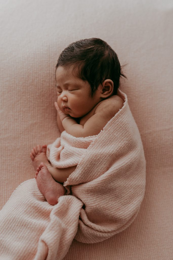 story telling family with newborn girl
