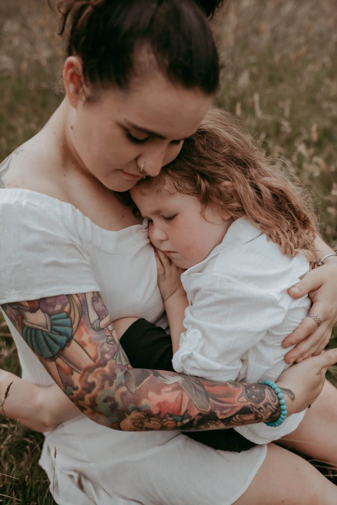 mother and son naturally posing for family portraits