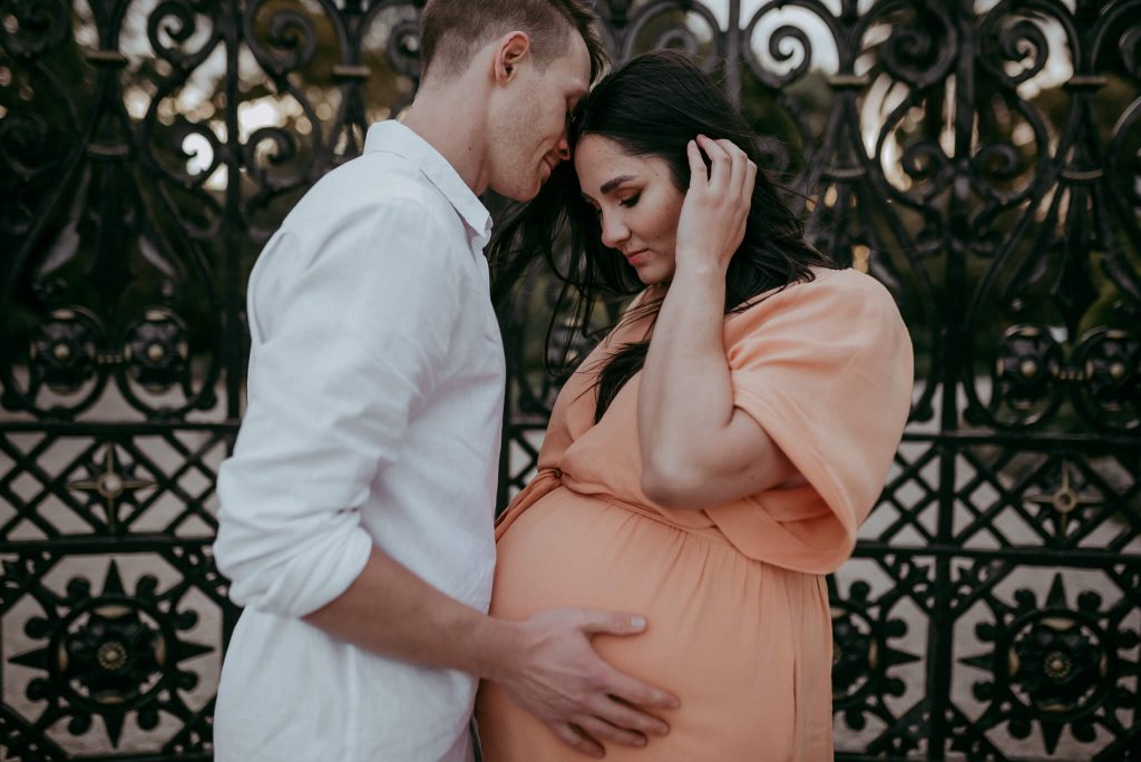 couple photographed with belly bump