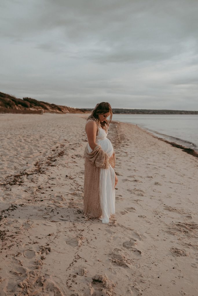 pregnant mother nurturing her belly