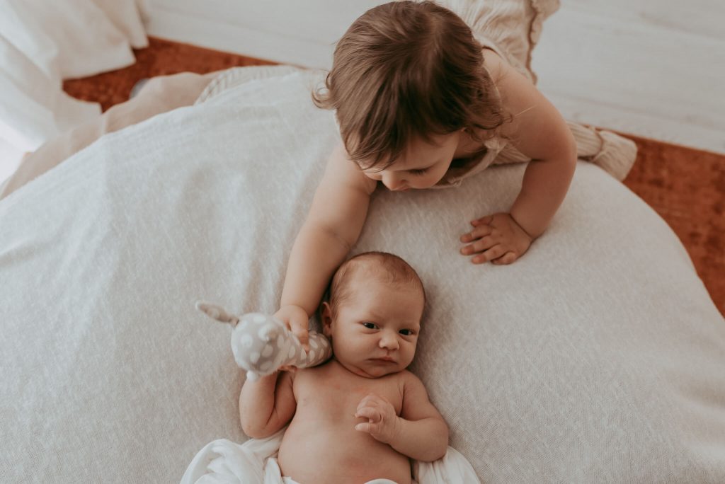 sibling together captured