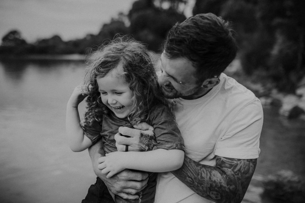 natural and relaxed photo of son and dad