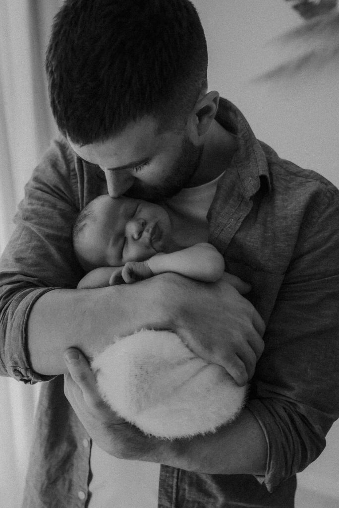 sweet newborn boy with dad