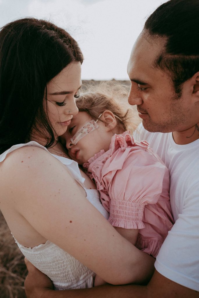 parents and daughter creating precious images