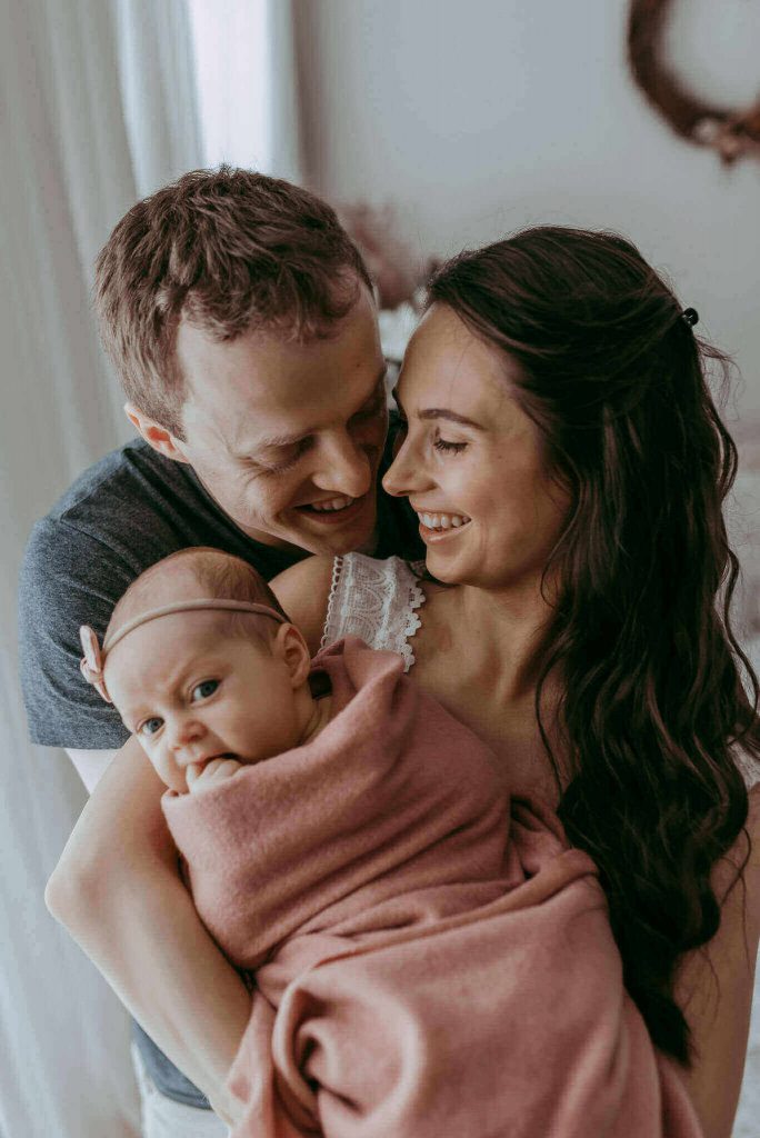 newborn baby girl with new parents