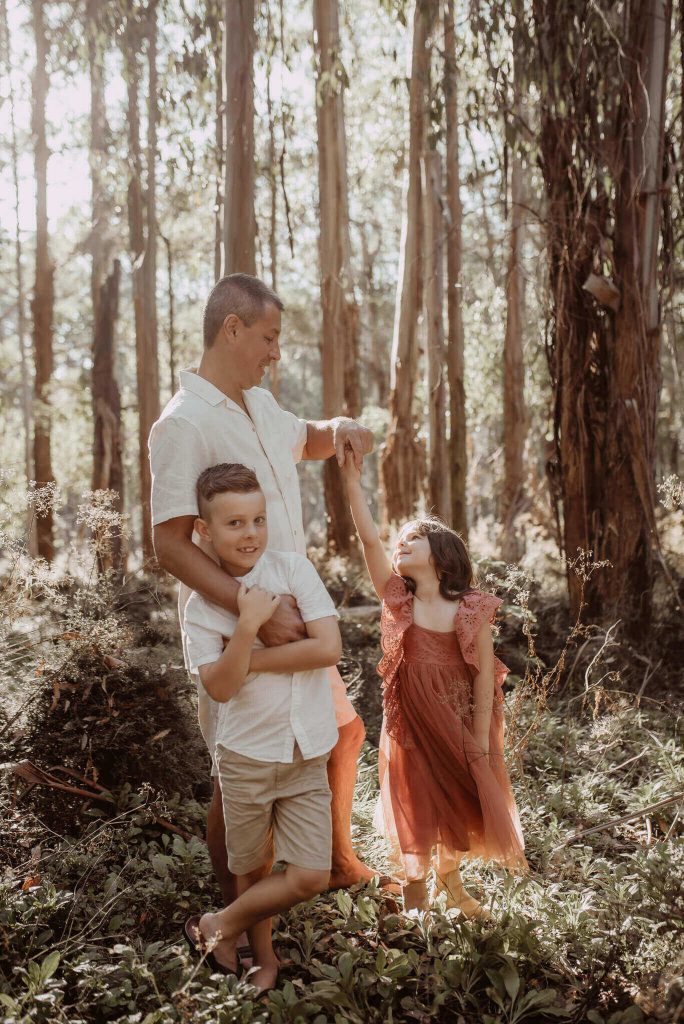 photo of family having having fun with dad