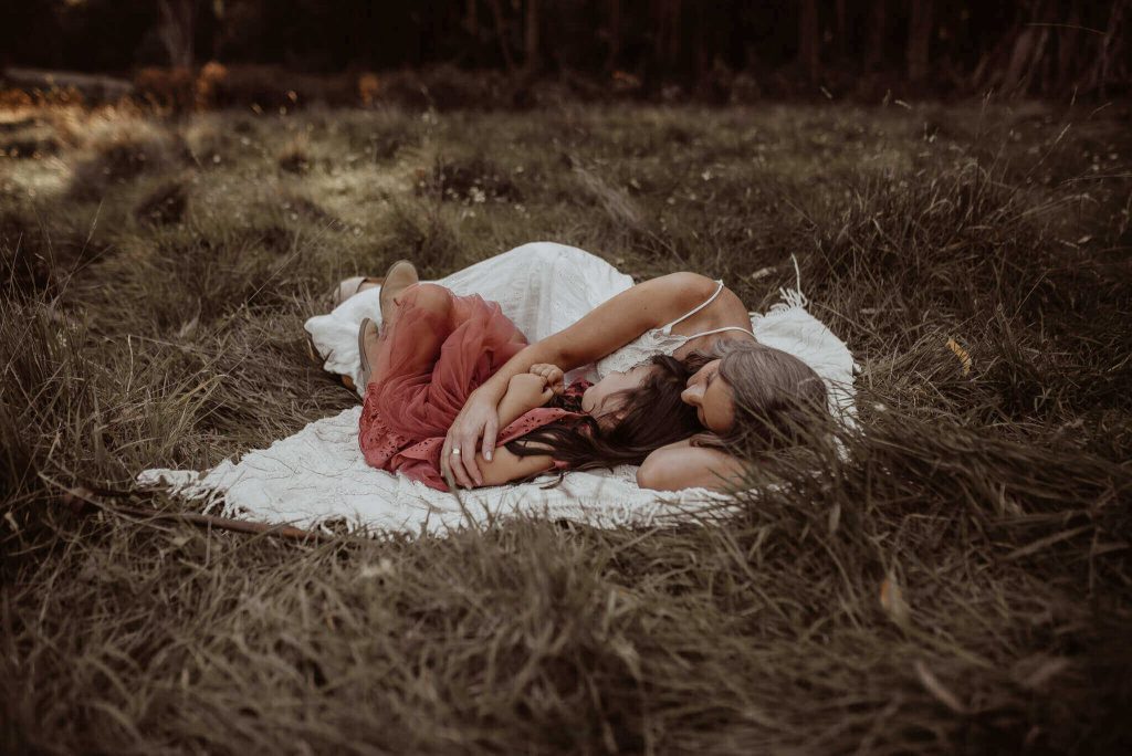 motherhood with daughter in the woods