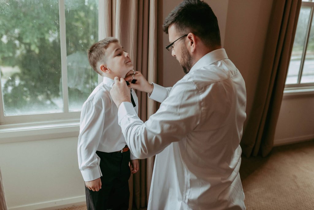 dudes getting ready for the wedding ceremony