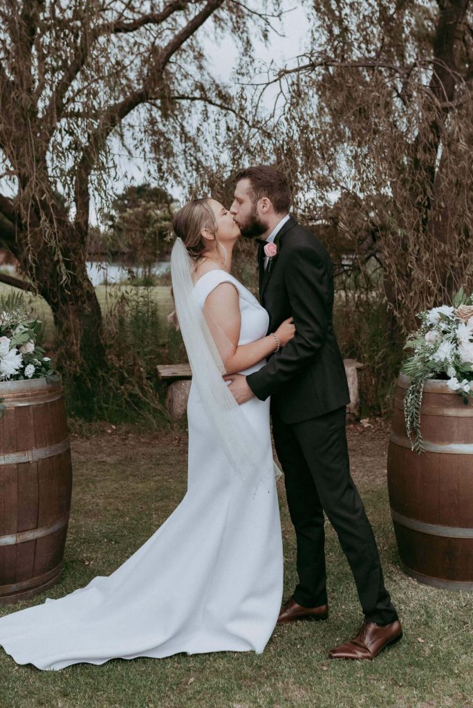 wedding first kiss in the garden